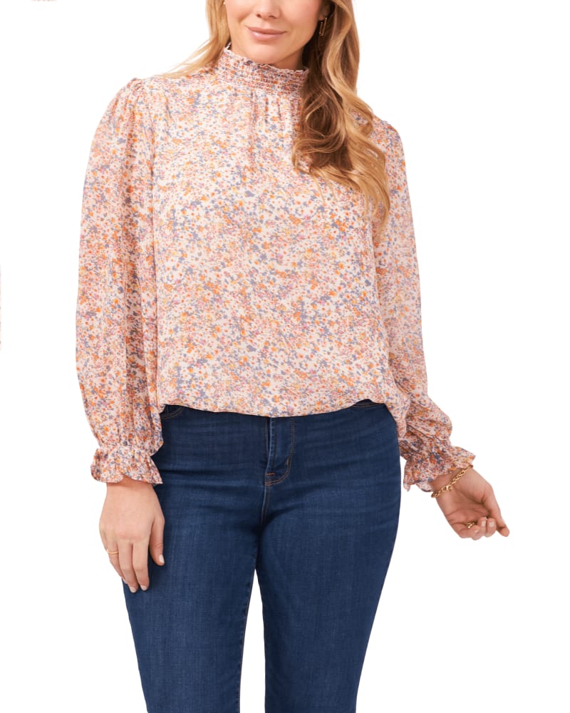 Front of a model wearing a size 0X Lucille Smock Neck Blouse in SWEET BLOOMS by 1.State. | dia_product_style_image_id:262135
